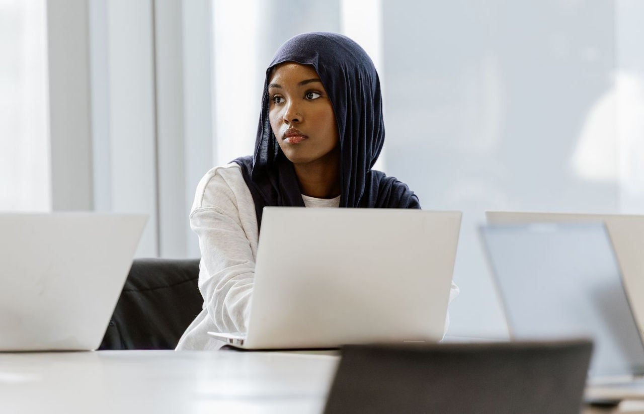 Photo of young person on laptop