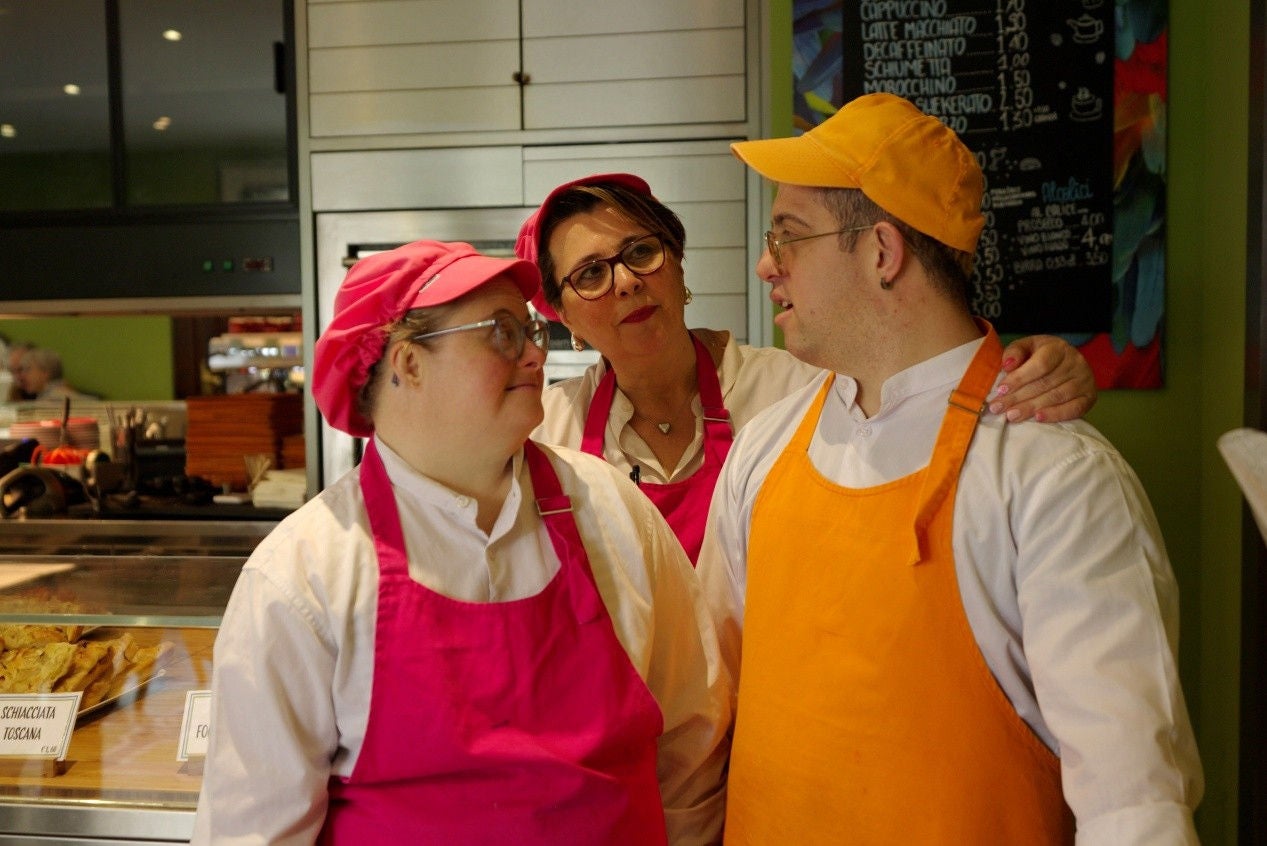 three people talking to each other
