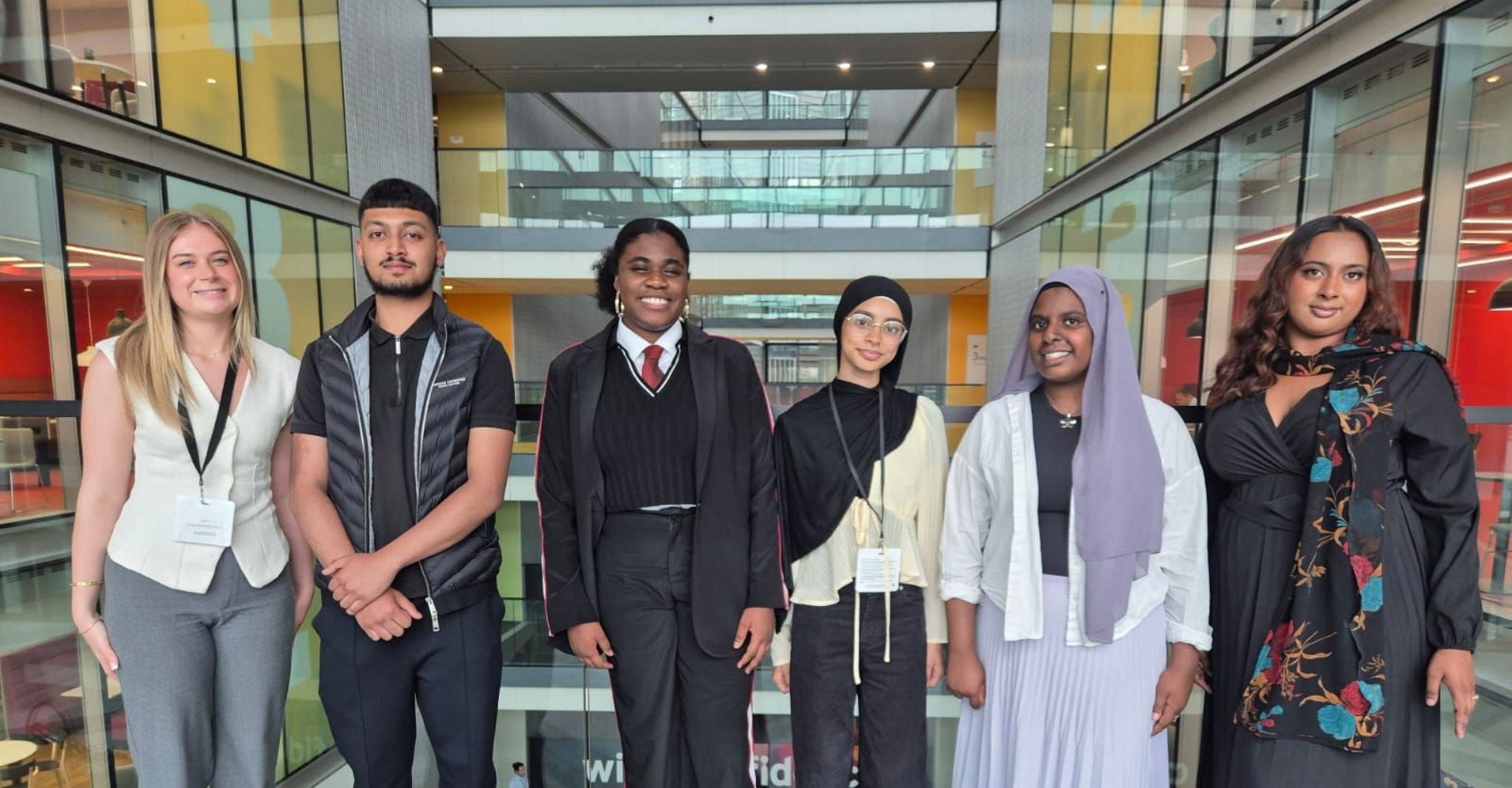 EY Foundation interns and apprentices stood together in the office