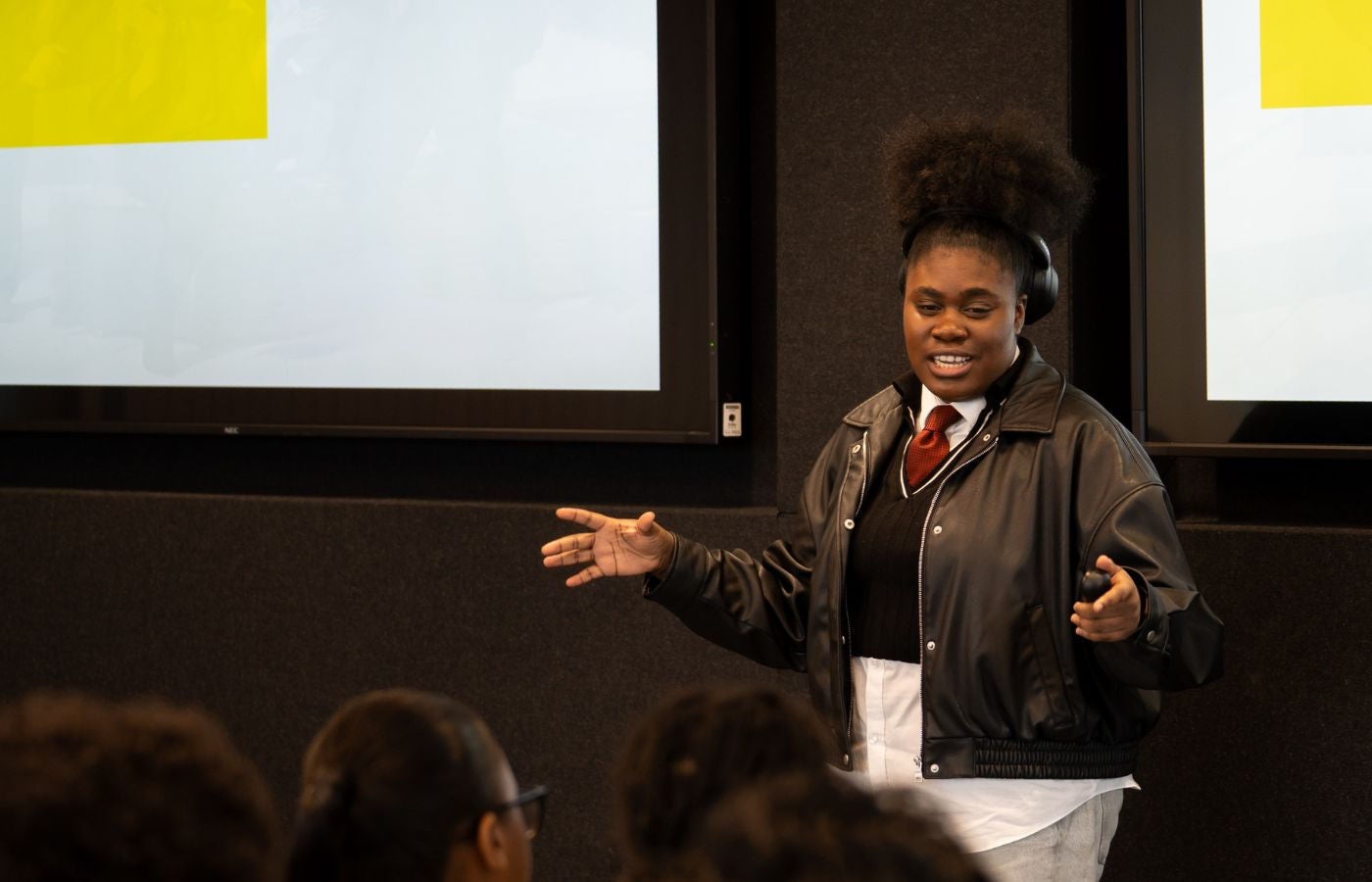 Johnae presenting to young people on a programme